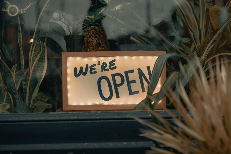 Close up of We're OPEN sign